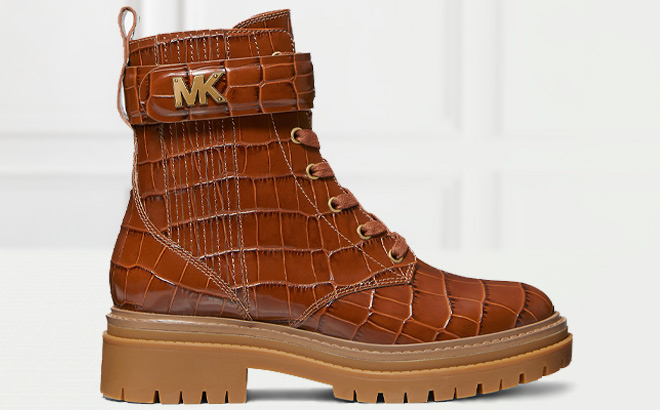 Michael Kors Stark Crocodile Embossed Leather Combat Boot in Chestnut Color on the Table