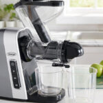 Omega Masticating Juicer with a Wide Mouth on the Kitchen Counter