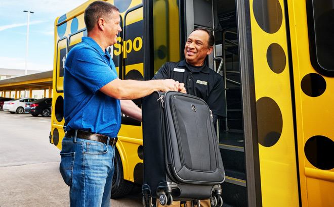 The Parking Spot Shuttle Driver Giving Luggage to a Person