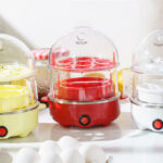 Three Bella 14 Egg Rapid Cookers in Yellow Red and White Colors