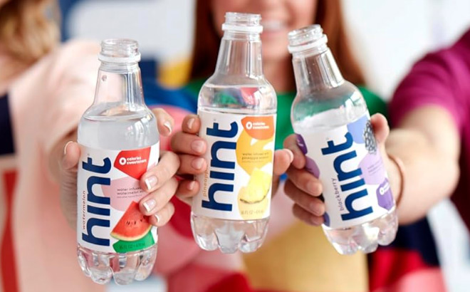 Three Persons Holding Hint Water Bottles