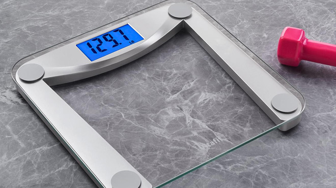 Vitafit Digital Bathroom Scale on the floow with a red dumbell on the side