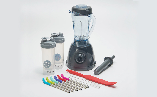 Vitamix One 32 oz Blender with Accessories on a Gray Background