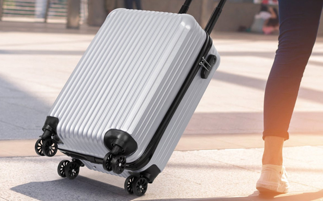 Woman Pulling Hikolayae Hardside Carry On Spinner Luggage