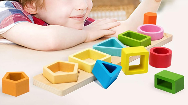 A Boy Playing with the Montessori Wooden Sorting and Stacking Toy