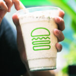 A Person Holding a Cup of Shake Shack Cookies and Cream Shake