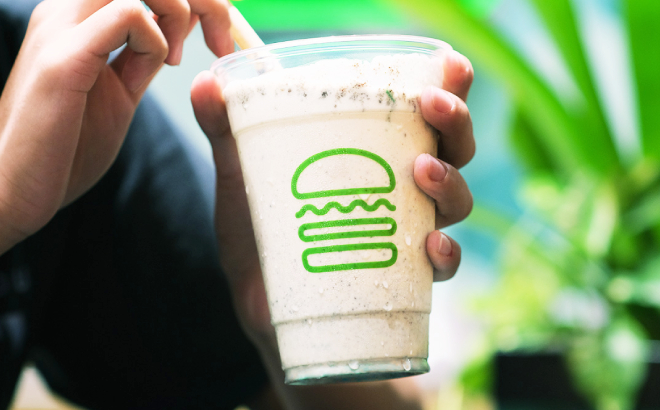 A Person Holding a Cup of Shake Shack Cookies and Cream Shake