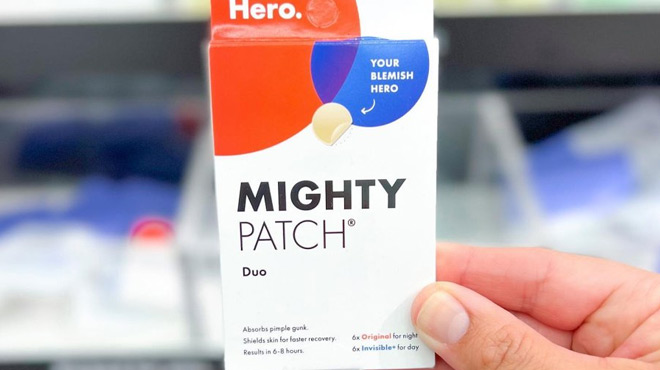 A Person Holding a Hero Mighty Acne Pimple Patch Duo 12 ct