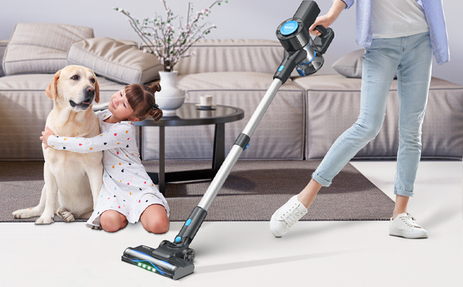 A Person Using the Cordless Lightweight Vacuum Cleaner in the Living Room