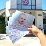 A Woman Holding Six 5×7 Photo Cards from Walgreens Photo