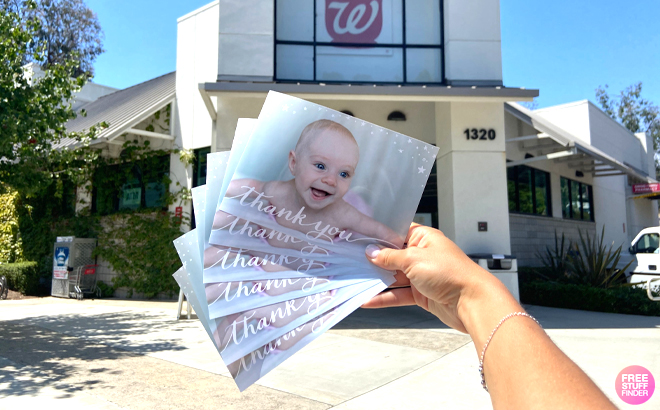 A Woman Holding Six 5×7 Photo Cards from Walgreens Photo