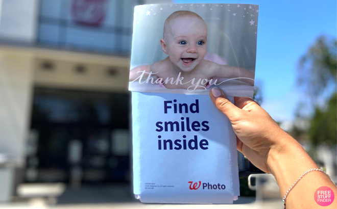 A Woman Holding a 5×7 Photo Card from Walgreens Photo