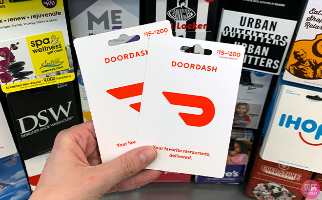 A person holding DoorDash Gift Cards