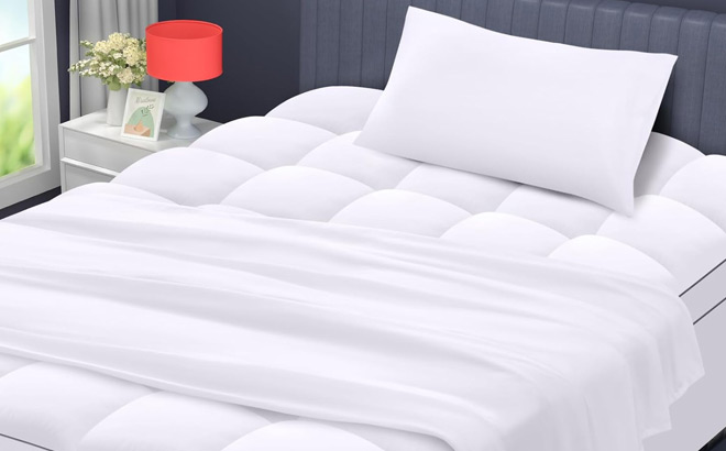 Mattress Topper on a Bed with Sheet and Pillowcase