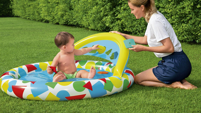 A Baby Playing in an H2OGO Inflatable Kiddie Pool