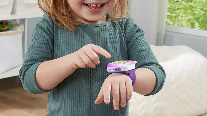 A Girl Wearing the VTech FirsTech Friends Smartwatch STEM Learning Toy