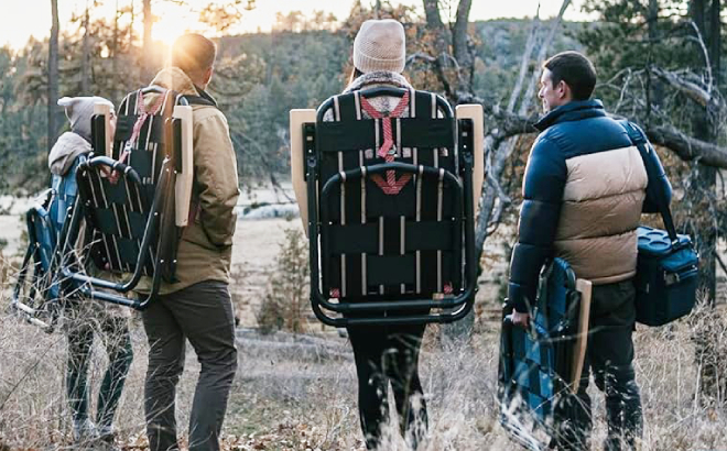 A Group of Friends Carrying a CleverMade Sequoia Folding Backpack Chair