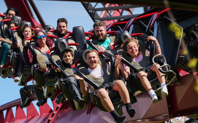 A Group of People Enjoying a Rife at Six Flags