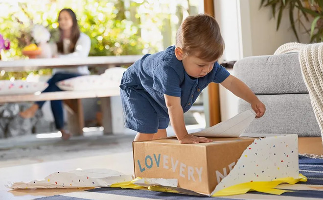 A Kid Opening a Box