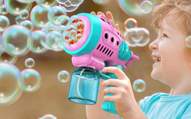 A Kid Playing with a Bubble Gun