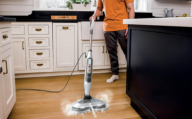 A Man Cleaning with the Shark Steam & Scrub Steam Mop