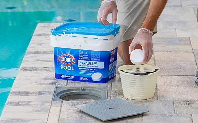 A Man Using the Clorox XtraBlue Pool Chlorinating Tablets