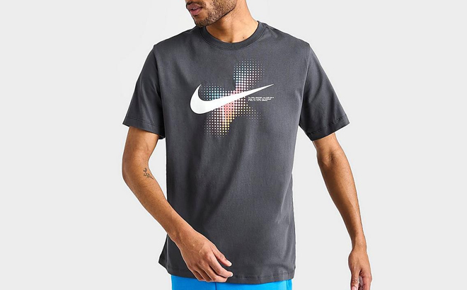 A Man Wearing Nike Sportwear Swoosh Dots Printed Graphic T Shirt