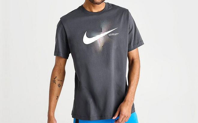 A Man Wearing Nike Swoosh Dots Printed Graphic Shirt