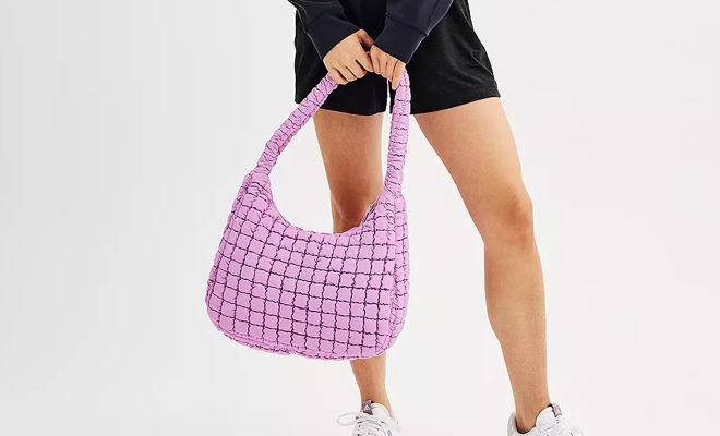 A Person Carrying the FLX Quilted Shoulder Bag in Pink