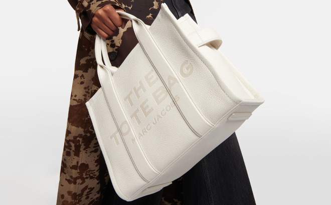 A Person Holding Marc Jacobs The Large Tote