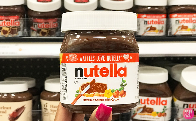 A Person Holding Nutella Hazelnut Spread With Cocoa For Breakfast