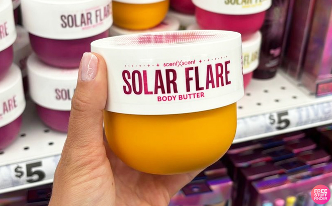 A Person Holding Solar Flare Body Butter Caramel Dreams