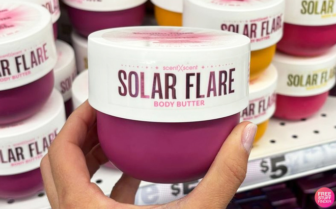 A Person Holding Solar Flare Body Butter Vanilla Plum