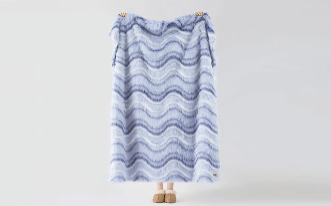 A Person Holding UGG Rosia Faux Fur Throw Blanket