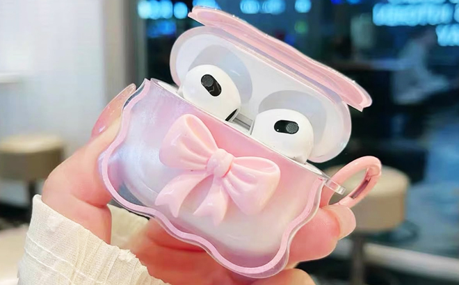 A Person Holding a Girly 3D Bow Design Airpod Case