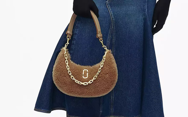 A Person Holding a Marc Jacobs Teddy Curve Bag