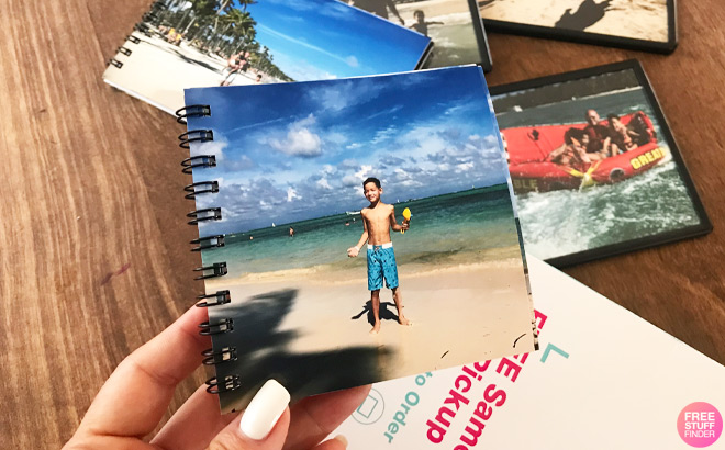 A Person Holding a Photo Print Book