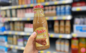 A Person Holding a Victor Allen Iced Coffee in Twix Flavor