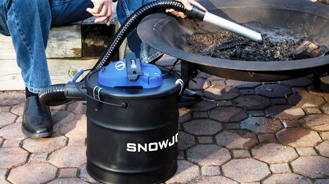 A Person Using Snow Joe 4 8 Gallon Ash Vacuum