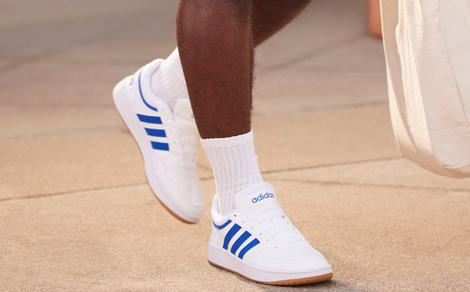 A Person Wearing Adidas Hoops 3 0 Sneaker