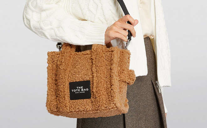 A Person Wearing Marc Jacobs The Small Tote in Camel Color