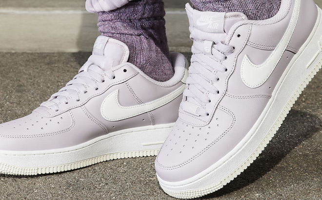 A Person Wearing Nike Womens Air Force 1 Shoes