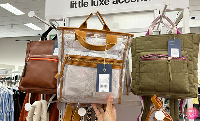 A Persong Holding the Universal Thread Mini Paxton Backpack at Target