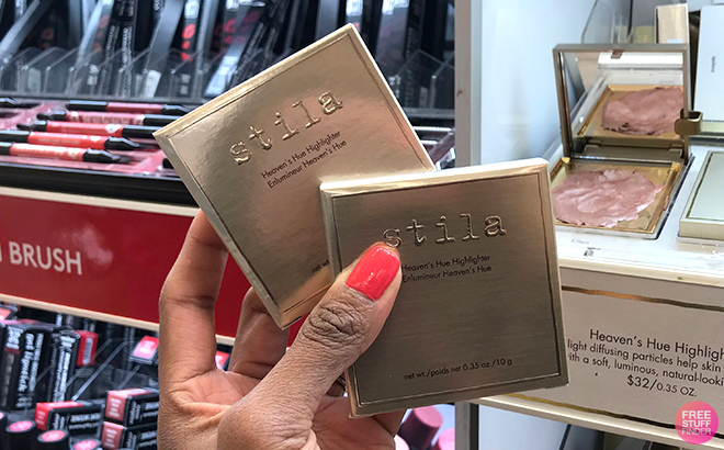 A Woman Holding Stila Heavens Hue Highlighters