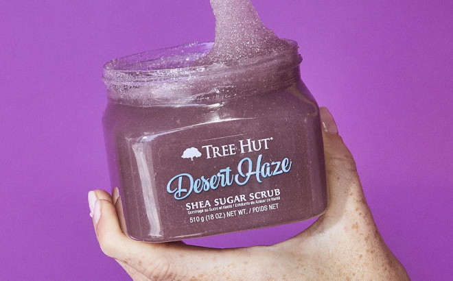 A Woman Holding Tree Hut Shea Sugar Scrub in Desert Haze