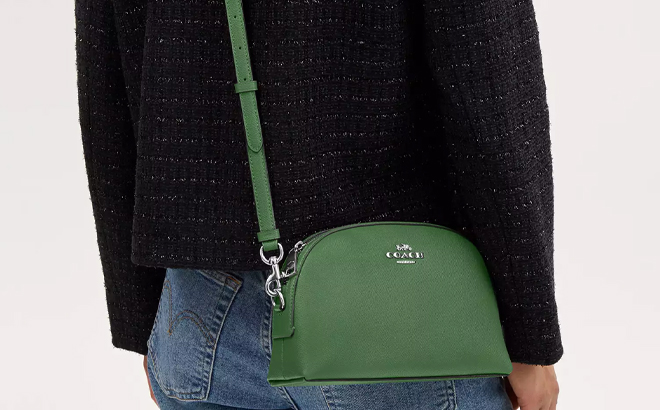 A Woman Wearing Coach Outlet Madi Crossbody