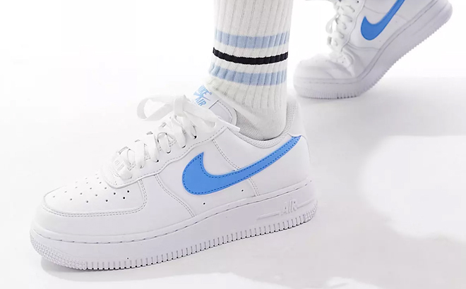 A Woman Wearing Nike Air Force 1 Sneakers