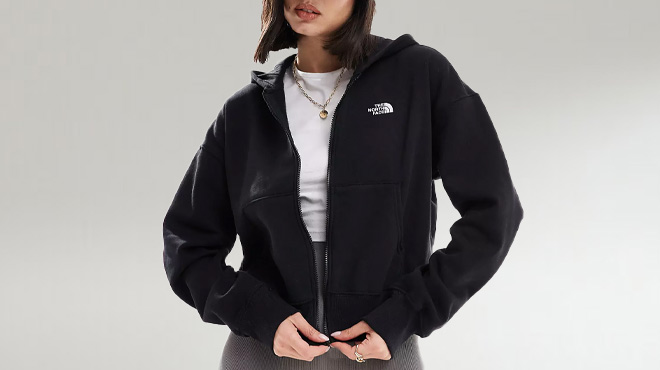 A Woman Wearing The North Face Evolution Full Zip Jacket in Black