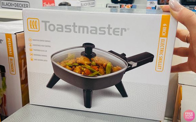 Hand Holding Toastmaster 6 in Electric Skillet