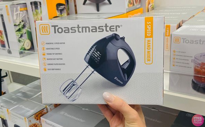 Hand Holding Toastmaster Hand Mixer